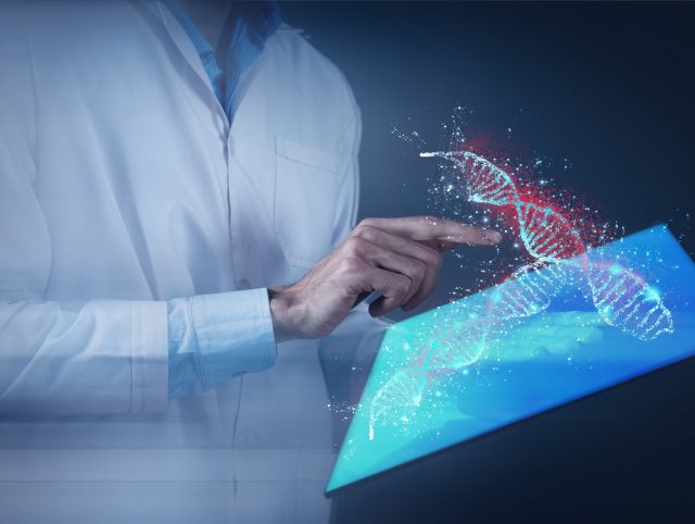 A man in a lab coat holds a tablet displaying a DNA structure, representing precision medicine platforms.