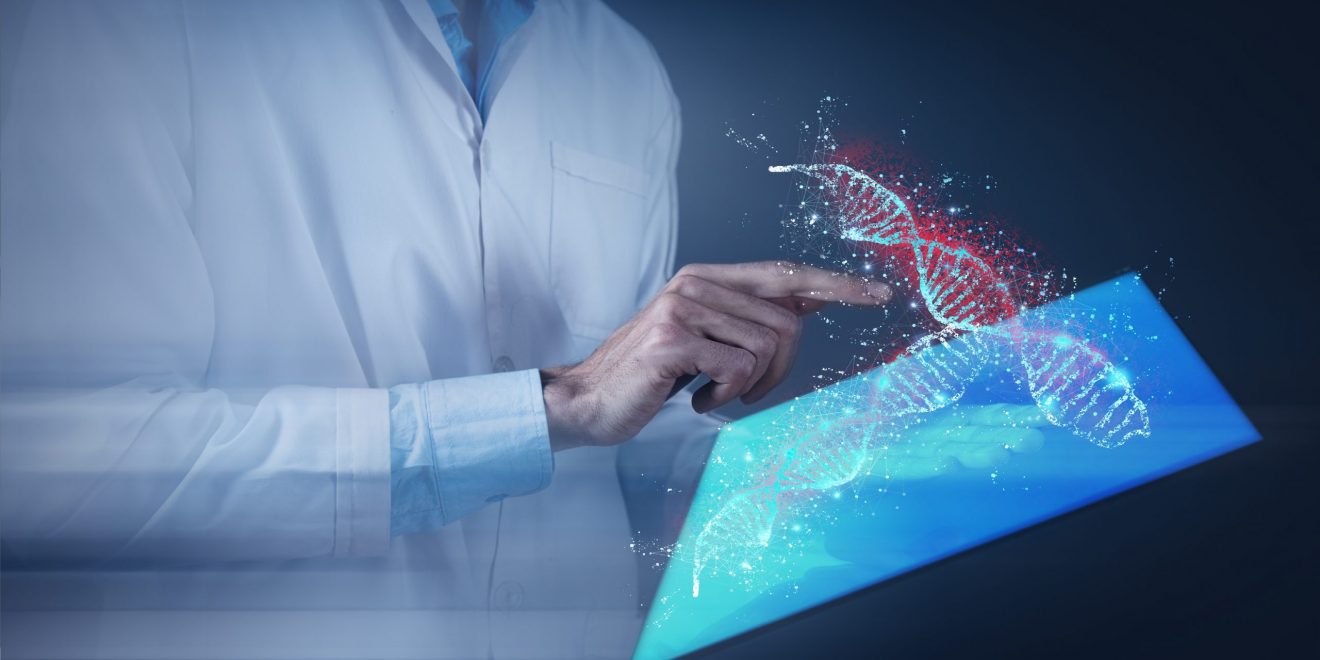 A man in a lab coat holds a tablet displaying a DNA structure, representing precision medicine platforms.