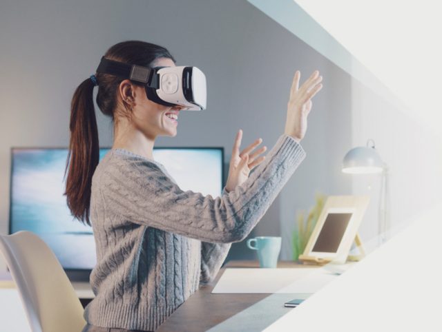 A woman immersed in VR therapy, wearing a virtual reality headset.